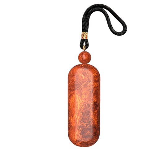 HANDCRAFTED PEACE AMULET FROM PRECIOUS WOOD, INLAID WITH 999 PURE SILVER